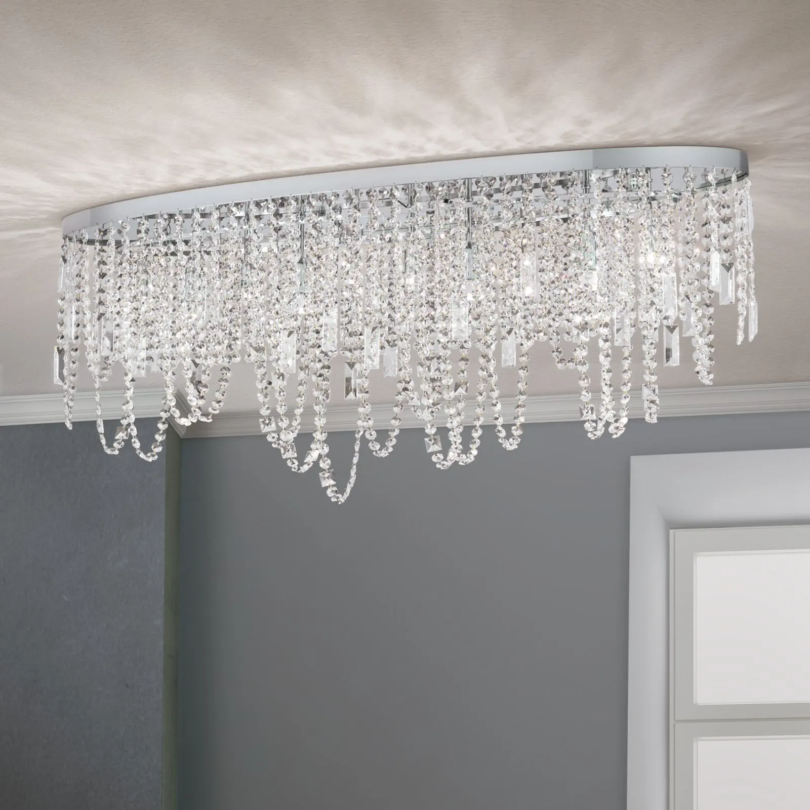 Plafonska lampa KRISTALLDESIGN, ovalni oblik, hromirana, 110 × 25 cm
