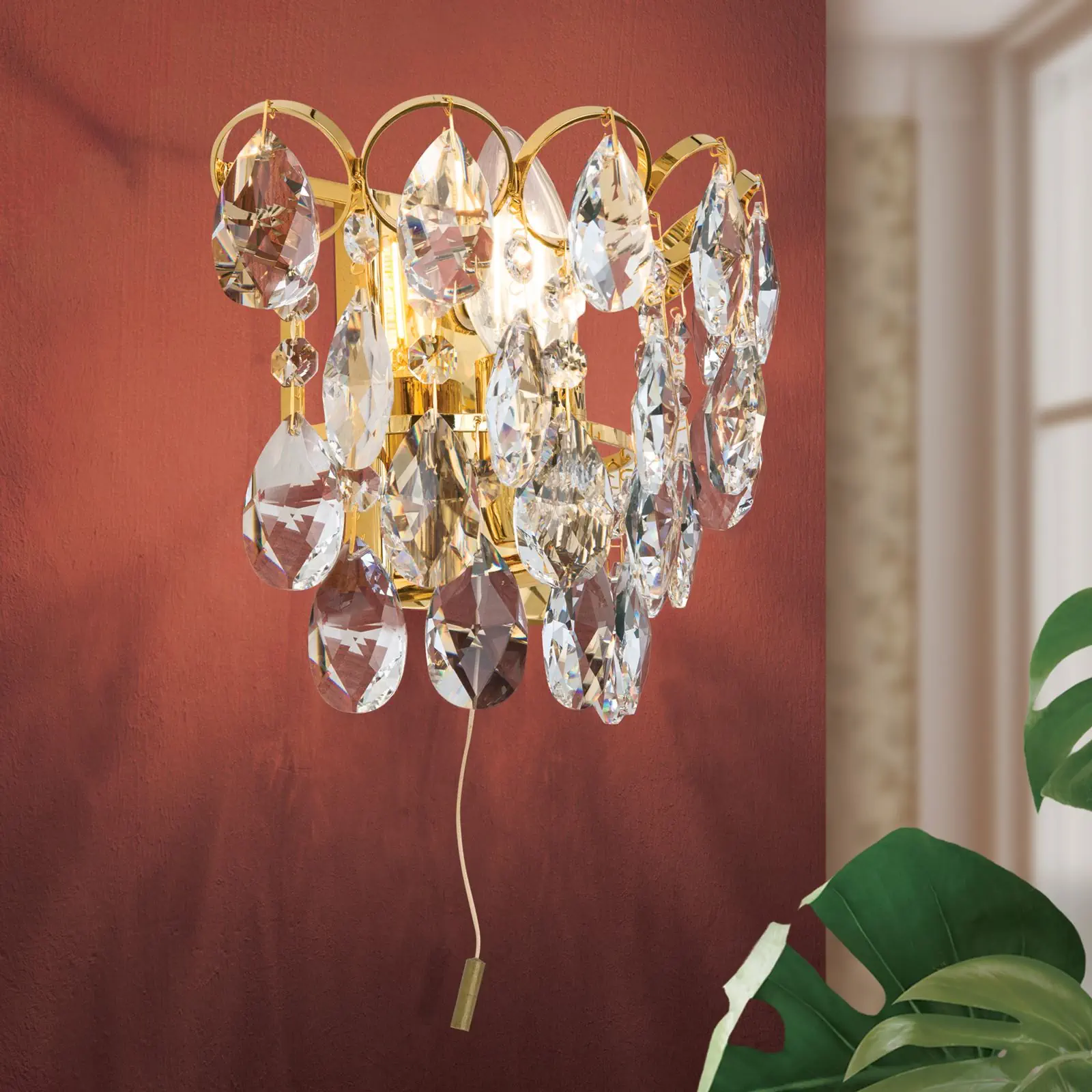 Zidna lampa KRISTALL KLASSISCH, sa jednim izvorom svetla, pozlaćena, sa prekidačem na povlačenje